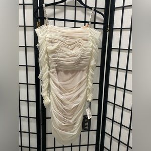 Vera Wang White never been worn nude/ivory dress in size 2. Crystal straps. Tags